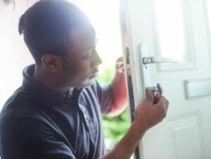 Man Changing Locks on a uPVC Door