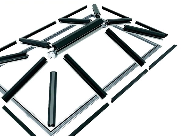 Black and silver metal frames scattered and partially assembled on a white background.